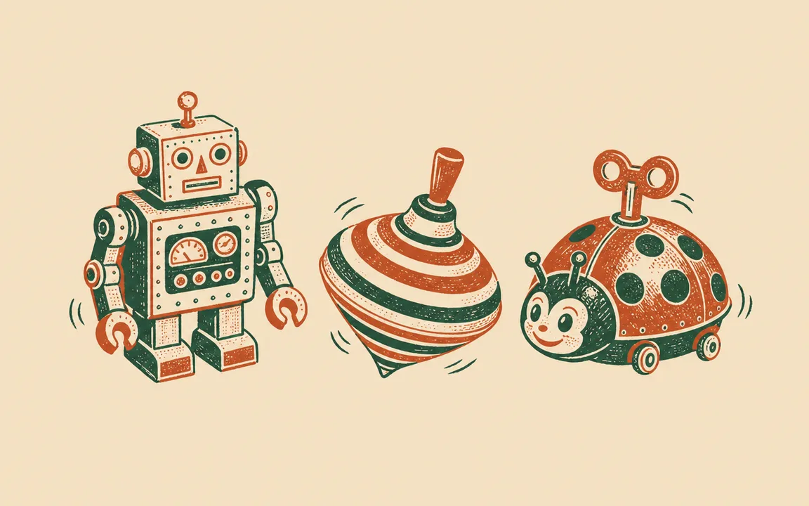 A boxy robot with a square head and claw hands stands beside a spinning top with striped bands and a ladybug-shaped toy with wheels, large eyes, and antenna on its head.